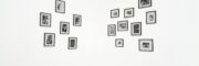 Minimalist display of black and white photos in gallery setting.